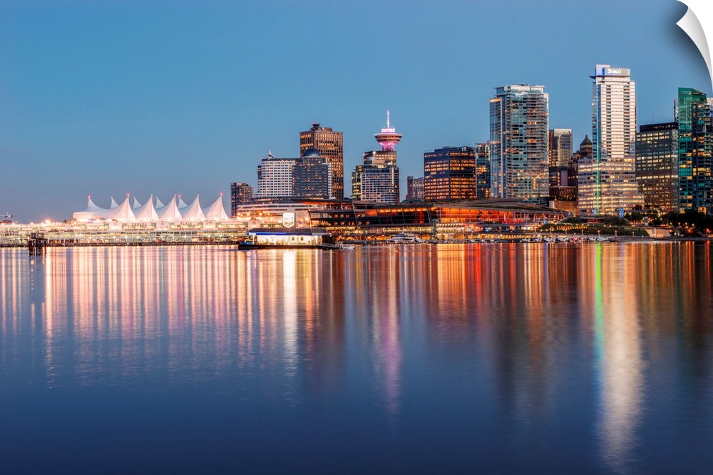 Bright reflections of Vancouver skyline during sunset in British Columbia, Canada.
