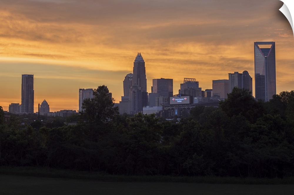 The sun rising on the largest city in North Carolina.