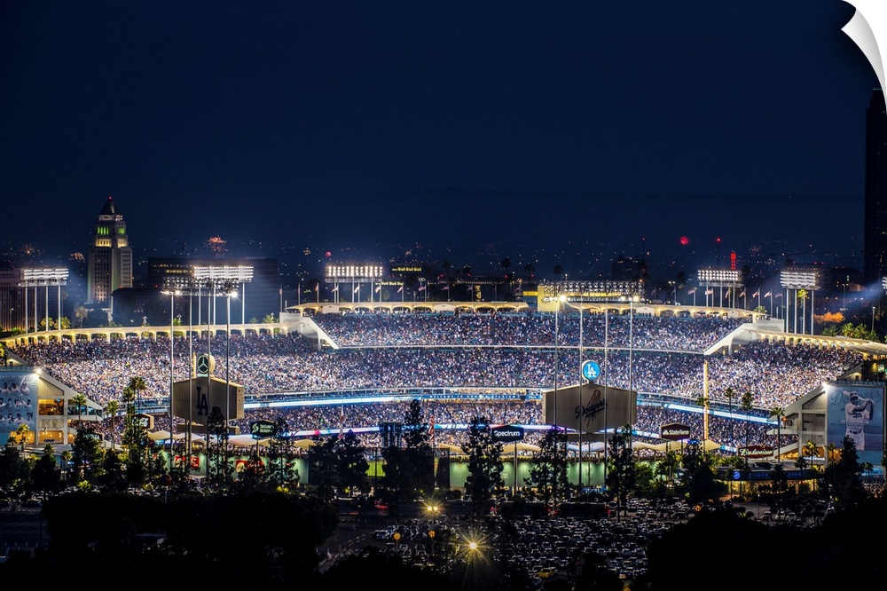 Photograph of Dodger Stadium lit up on a game night.