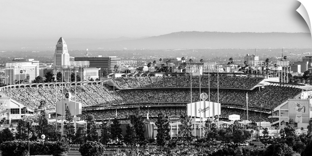 Panoramic photograph of Dodger Stadium lit up on a game night.