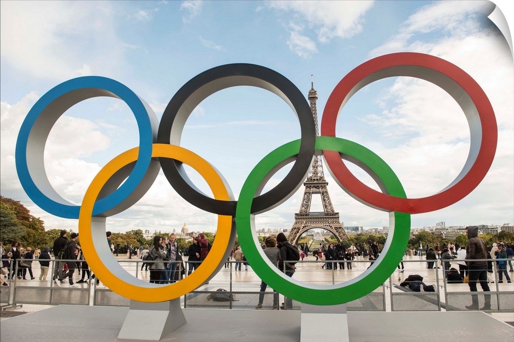 Photograph of the Olympic Rings with the Eiffel Tower in the background.