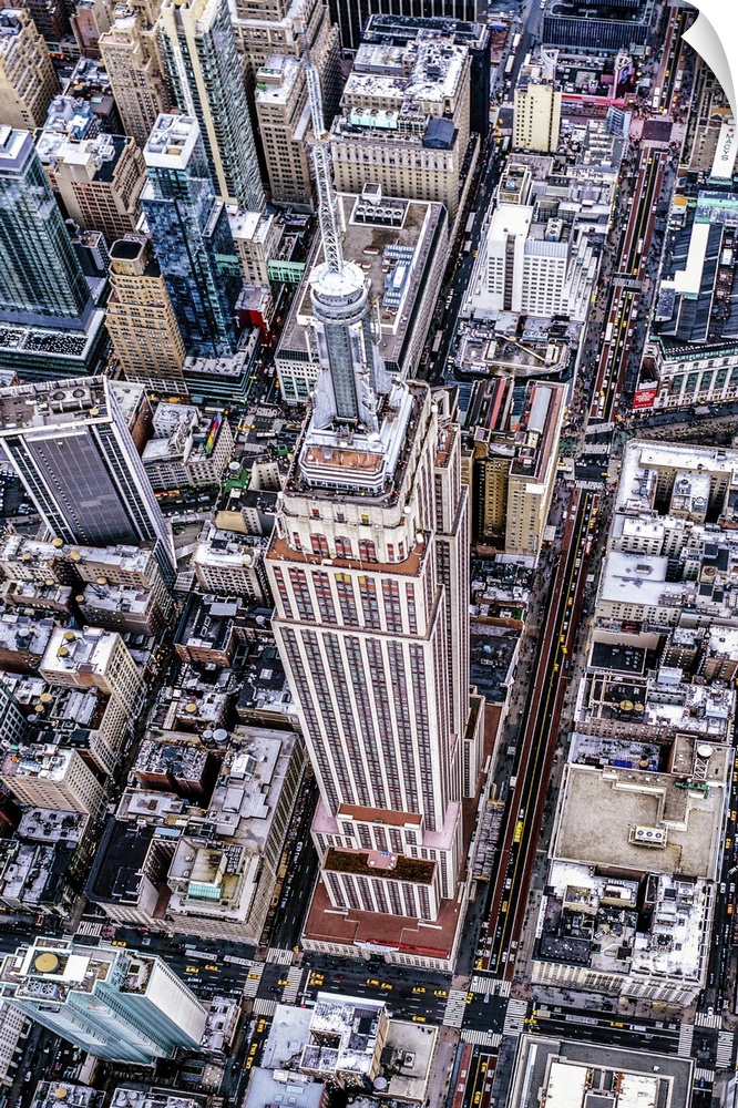 Aerial view of the Empire State Building surrounded by skyscrapers in New York City.