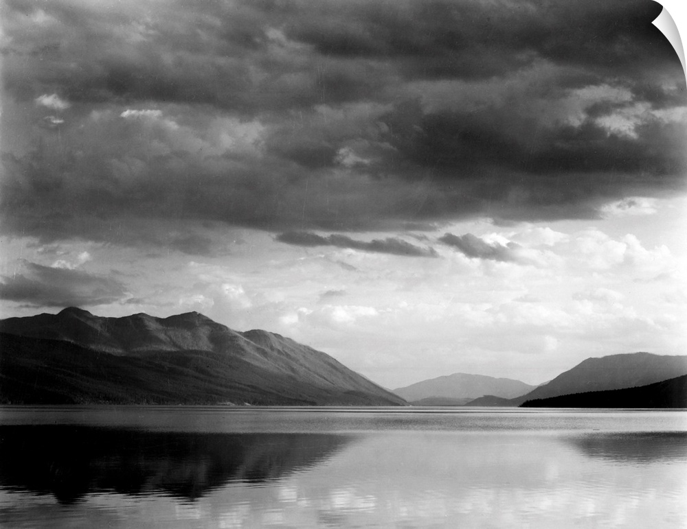 Evening, McDonald Lake, Glacier National Park, looking across lake to mountains and clouds.