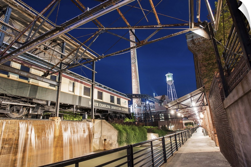 Exposed beams and brick add to the industrial aesthetic at the redeveloped American Tobacco Historic District, night, Durh...
