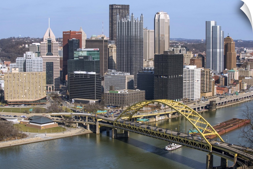 Aerial view of Pittsburgh, Pennsylvania, with the Fort Pitt Bridge leading into the city.