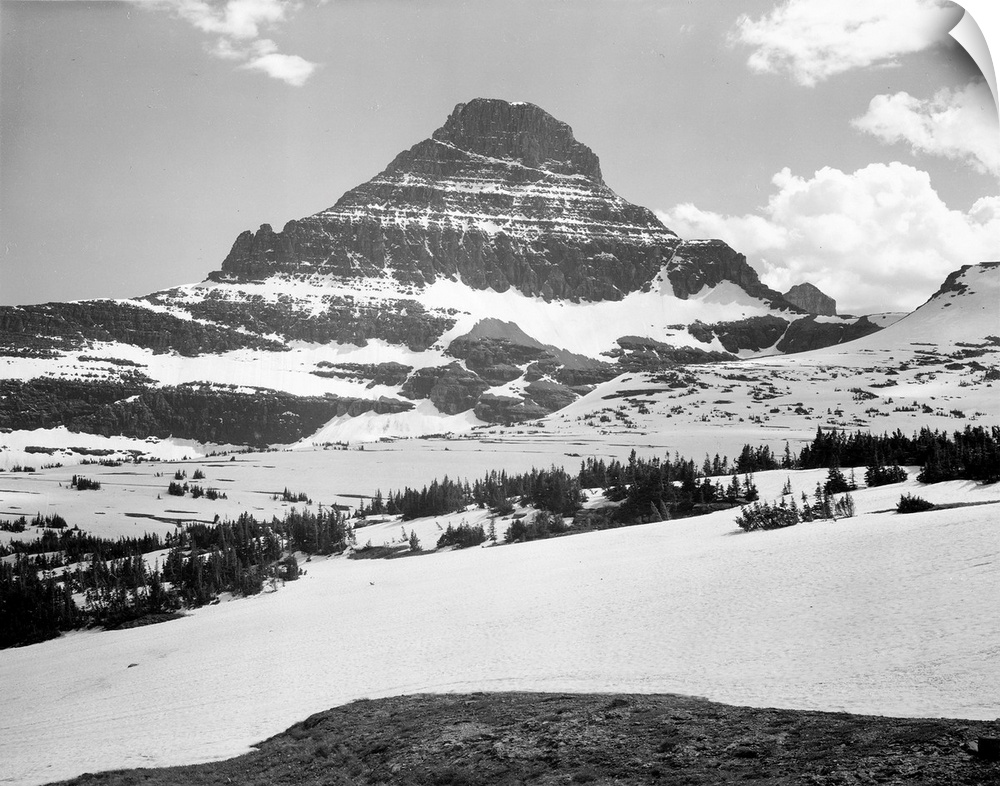 From Logan Pass, Glacier National Park, looking across barren land to mountains.