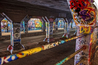 Graffiti covering the columns and railings in the Krog Street Tunnel in Atlanta, Georgia