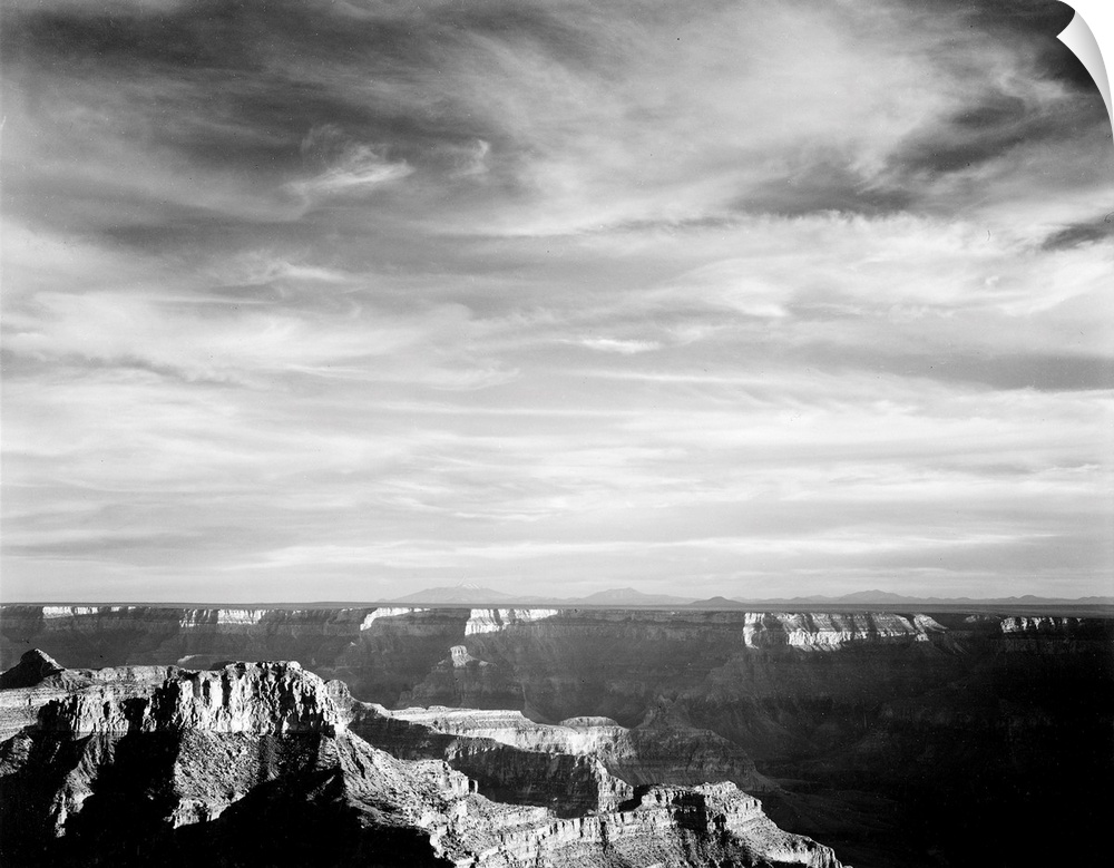 Grand Canyon from N. Rim, 1941, canyon in foreground, horizon, mountains and clouded sky.
