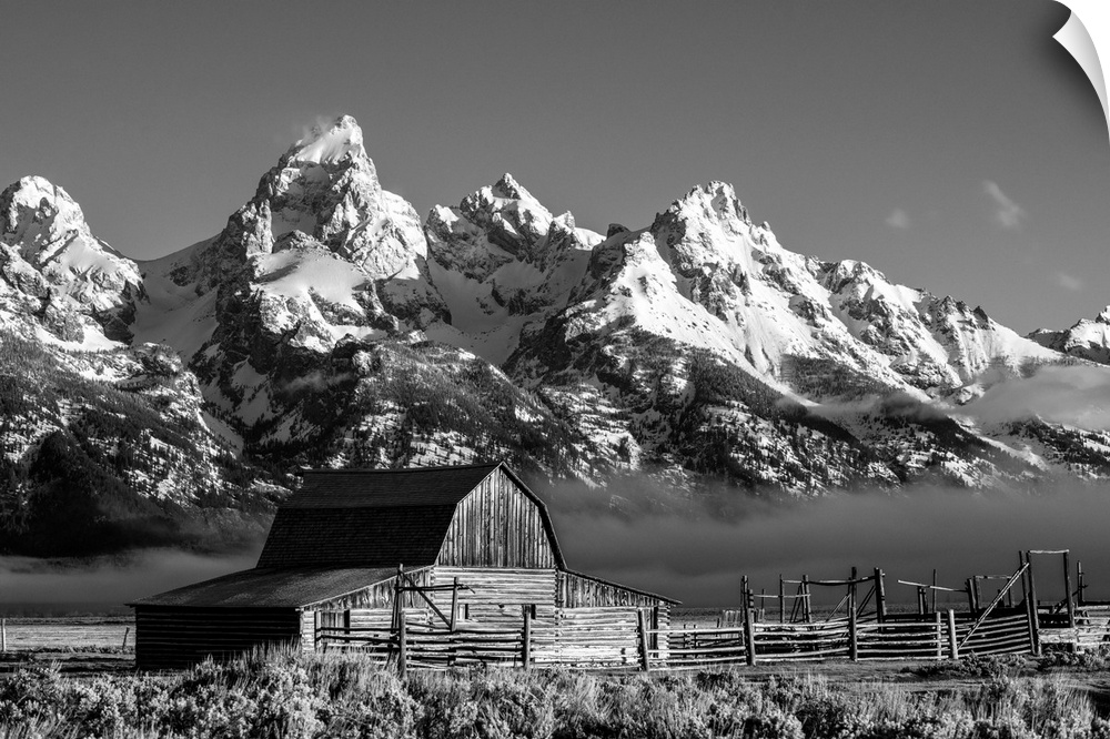 The John Moulton barn sits against a picturesque landscape of the Teton mountain range in Wyoming.