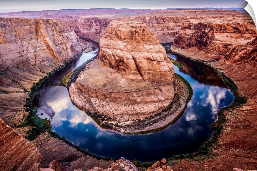 Landscape photograph of Horseshoe Bend in Arizona with the blue and green Colorado River reflecting the sky above and cont...