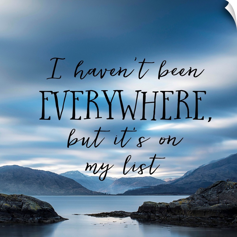 Black text reading "I haven't been everywhere, but it's on my list" over an image of a misty bay with an overcast sky.