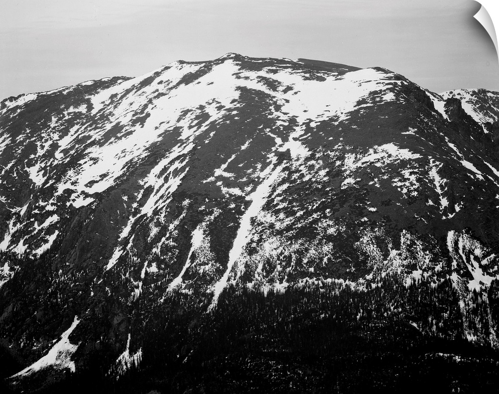 In Rocky Mountain National Park, full view of barren mountain side with snow.