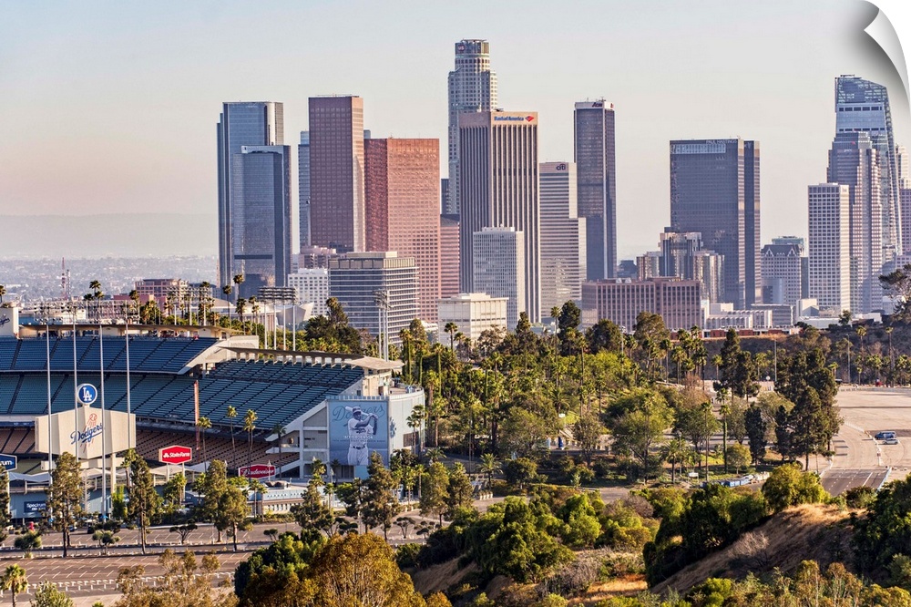Photograph of the downtown Los Angeles skyline with Dodger Stadium on the left.