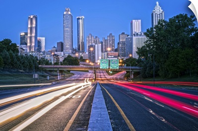 Light trails from traffic with the Atlanta, Georgia skyline at dusk