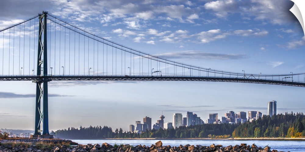 Photograph of Lion's Gate Bridge over the Burrard Inlet with the Vancouver, BC, Canada skyline in the distance.