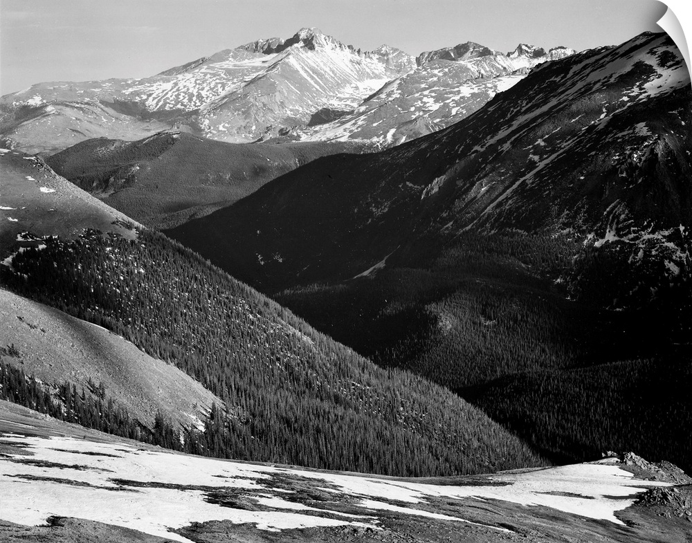 Long's Peak, Rocky Mountain National Park, close in panorama, dark shadowed hills in foreground, mountains in background.