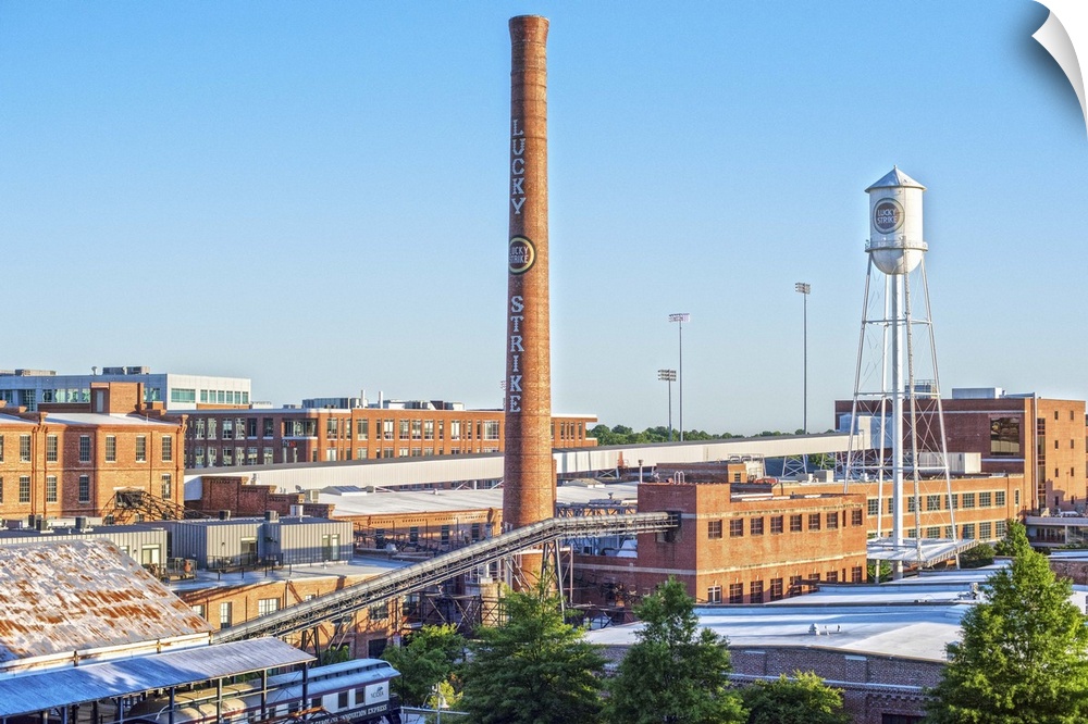 Lucky Strike Water Tower and Smokestack over the brick factory building, American Tobacco Historic District, Durham, North...