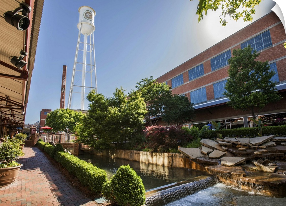 Lucky Strike Water Tower and Smokestack over a water feature running through the redeveloped American Tobacco Historic Dis...