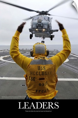 Military Poster: Petty Officer guides an SH-60R Sea Hawk helicopter