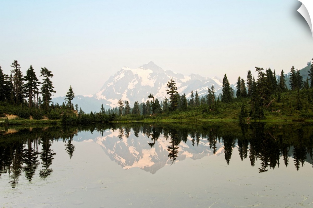 Photograph of Mt. Shuksan reflecting into Picture Lake around on a clear day.