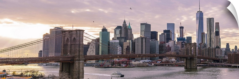The Brooklyn Bridge and New York City Skyline, New York, seen in the morning.