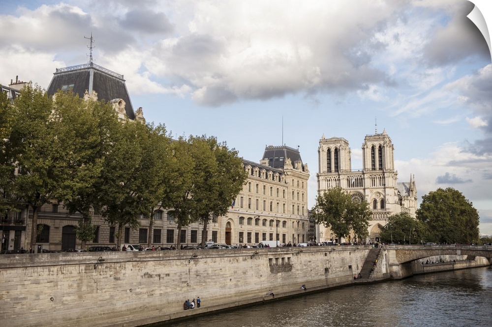 Photograph of the Notre Dame gothic architecture from the water.