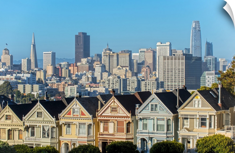 Photograph of the Painted Ladies in downtown San Francisco with tall buildings in the background.