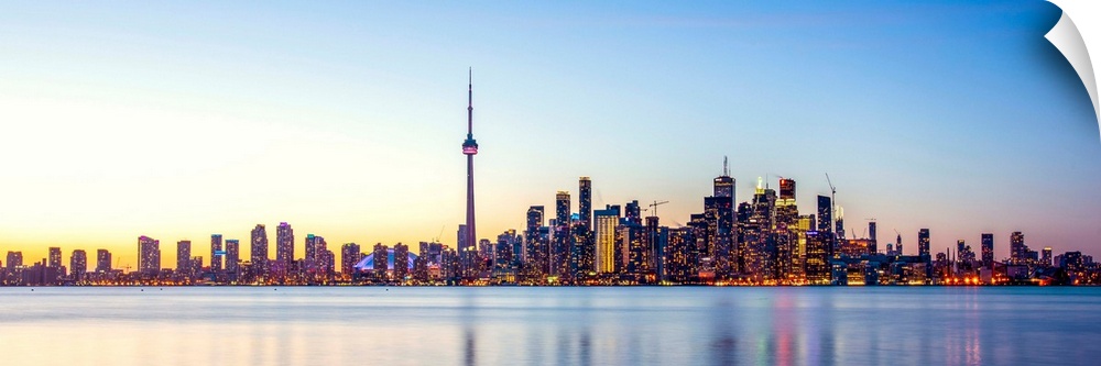 Panoramic photo of Toronto city skyline at sunset, Ontario, Canada.