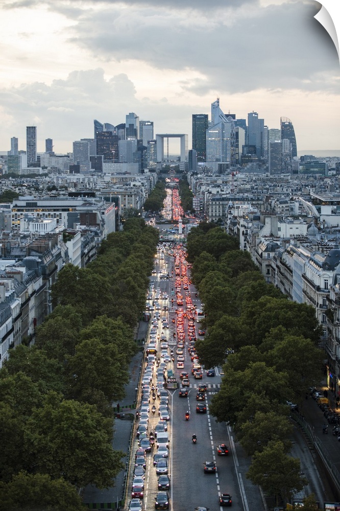 Aerial photograph of the Paris skyline at rush hour.