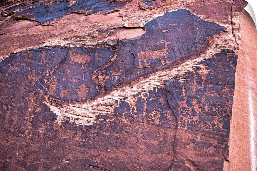 Ancient petroglyphs carved into sandstone on Potash Road, Arches National Park, Moab, Utah.