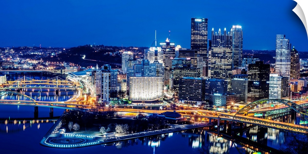 Photo of downtown Pittsburgh at night with Point State park.