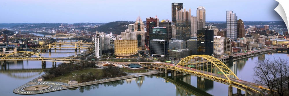 Skyscrapers and bridges in Pittsburgh, Pennsylvania, at nightfall.
