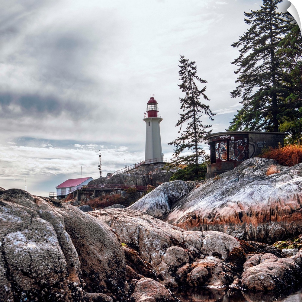 View of Point Atkinson Lighthouse and rocky shore in Vancouver, British Columbia, Canada.