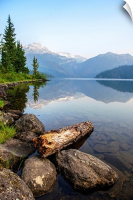 Reflection On Callaghan Lake With Rocks In British Columbia, Canada