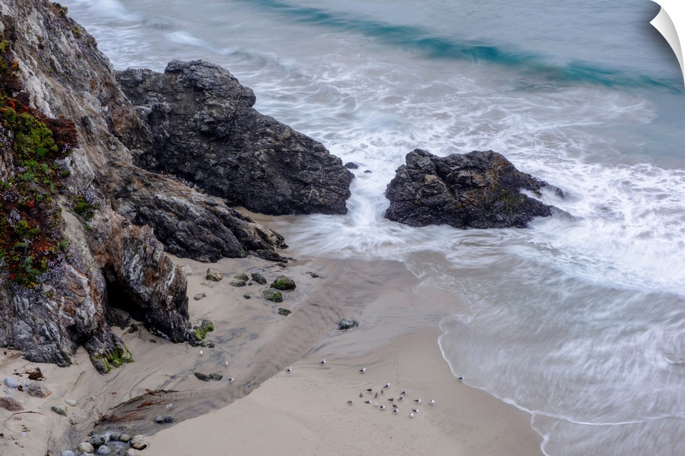 View of Rocky Creek Bridge beach rocks in Monterey County, California.