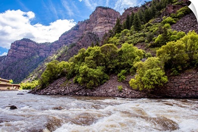 Rushing River under a Mountain Cliffside in Colorado