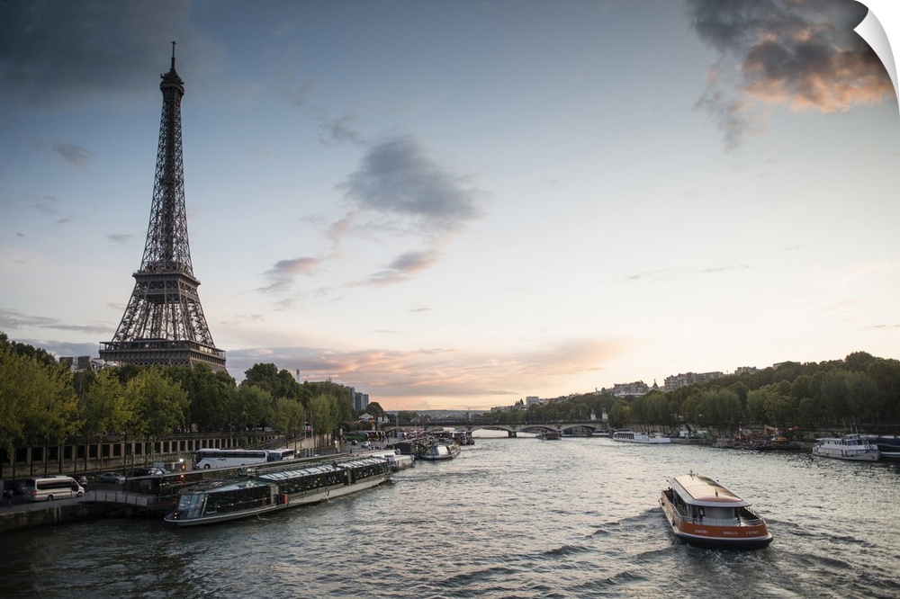 Landscape photograph of the Seine River with the Eiffel Tower on the side.