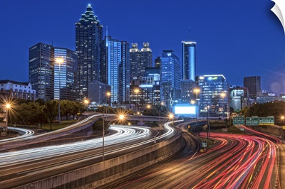 Skyline of Atlanta, Georgia, at night with light trails in the streets