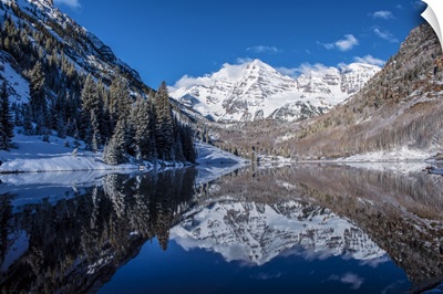 Snowy Maroon Bells mirrored in Maroon Lake below, Aspen, Colorado