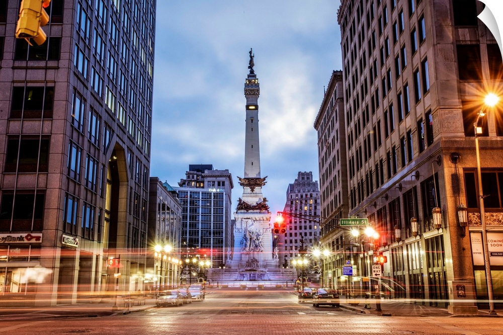 The Soldiers and Sailors Monument in the evening with lights from passing traffic in Indianapolis, Indiana.