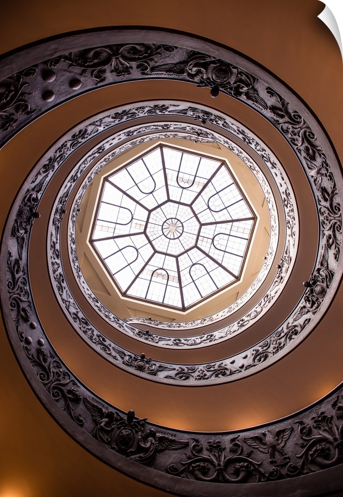 Photograph of the spiral staircase in the Vatican History Museum leading up to the beautiful skylight window.