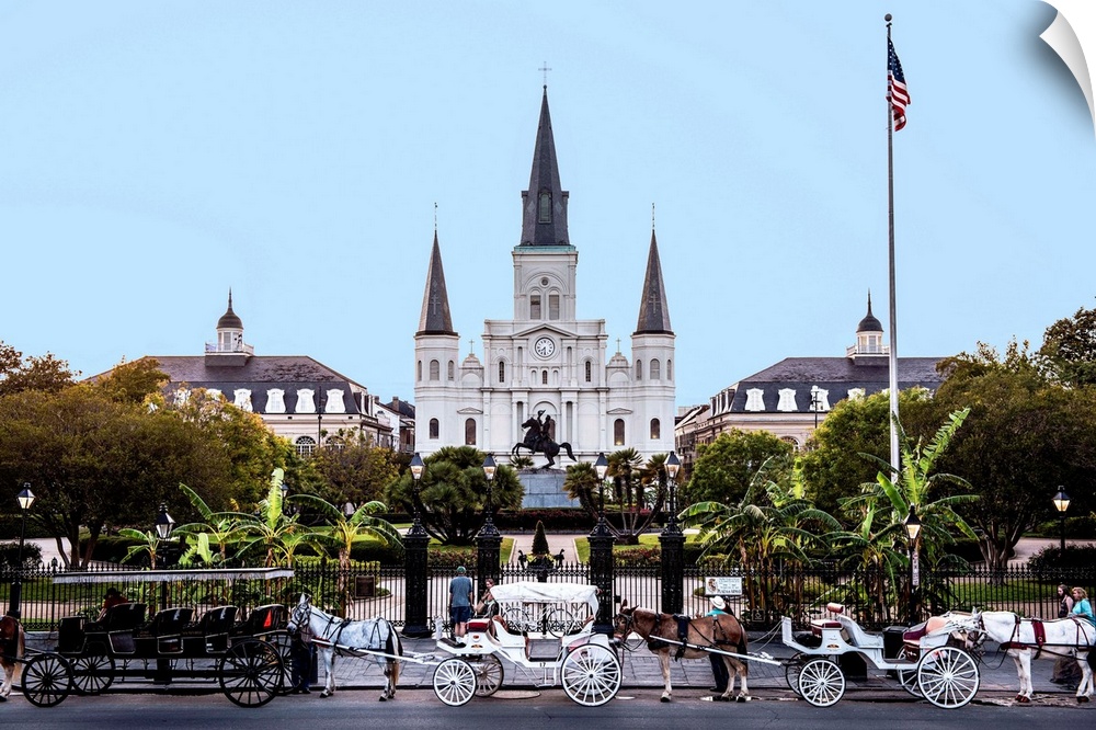 View of carriages stand in front of St. Louis Cathedral and Jackson Square in New Orleans, Louisiana.