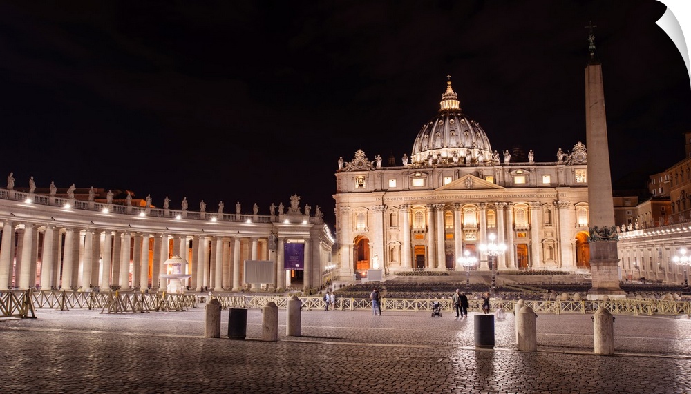 Photograph of St. Peter's Basilica at St. Peter's Square in Vatican City at night.