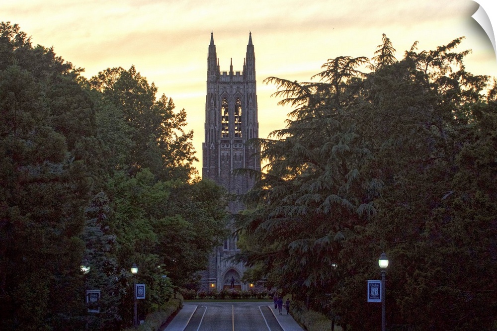 Road leading to the silhouetted steeple of Duke Chapel, Duke University, Durham, North Carolina.