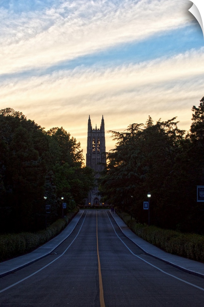 Road leading to the silhouetted steeple of Duke Chapel, Duke University, Durham, North Carolina.