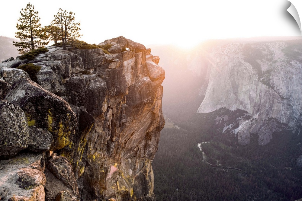 The sun sets on a mountain landscape in Yosemite National Park, California.
