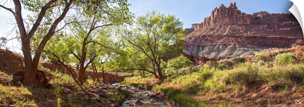 View of 'The Castle' rock formation near a stream at Capitol Reef National Park.