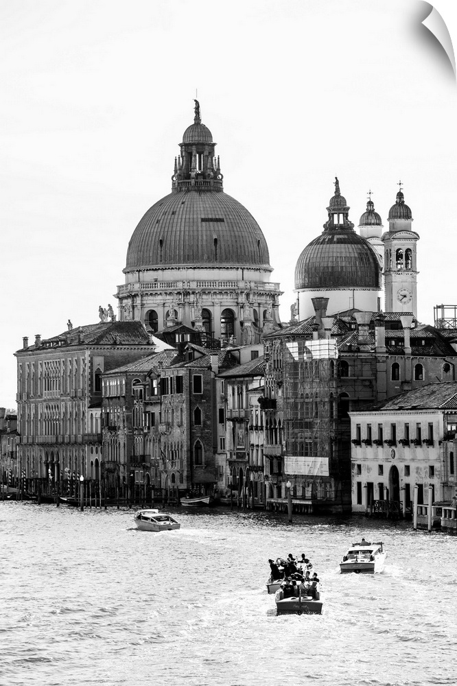 Landscape photograph of gondolas and boats on the Grand Canal with Santa Maria della Salute in the background.