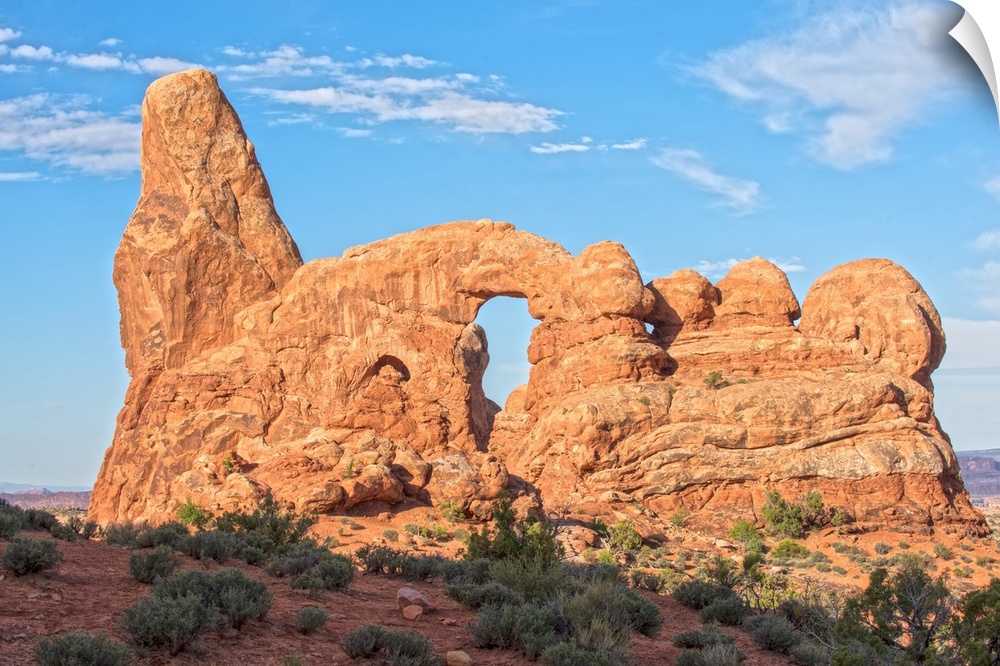 The Turret Arch under a blue sky in Arches National Park, Utah.