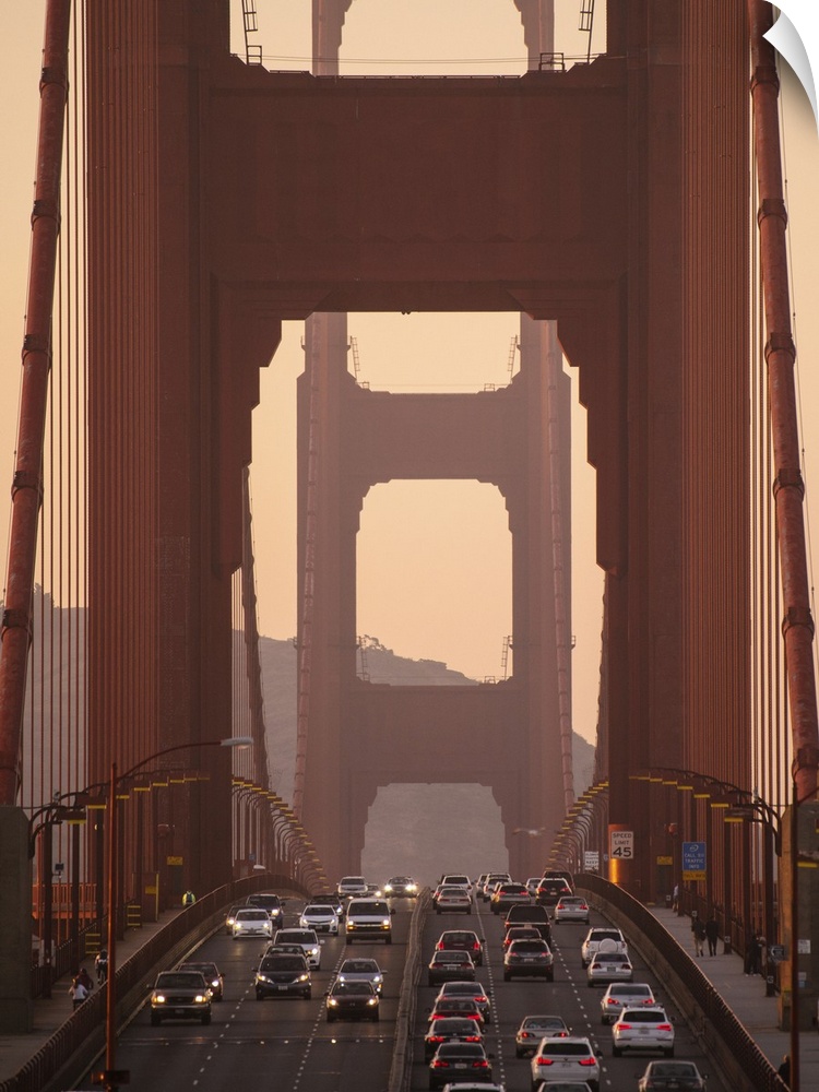 Sunset photograph of traffic on the Golden Gate Bridge in San Francisco.